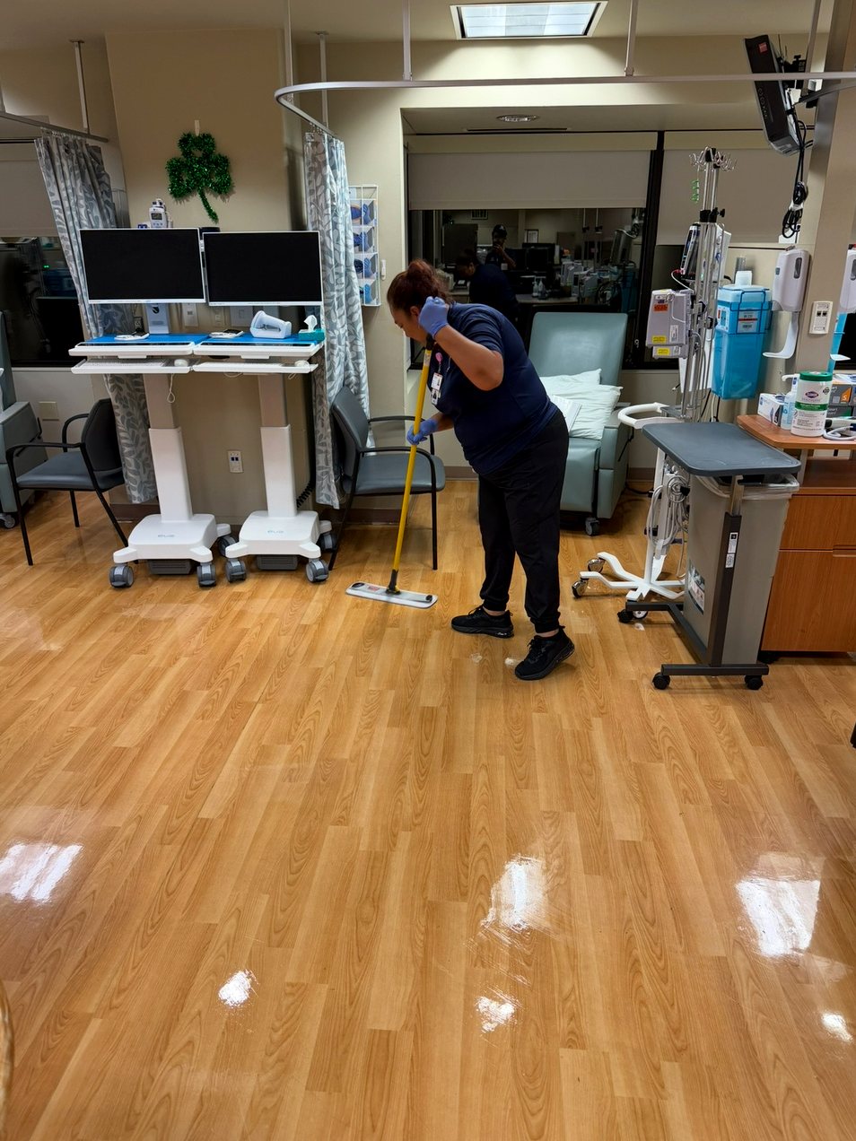 UFG environmental services technician performing floor care